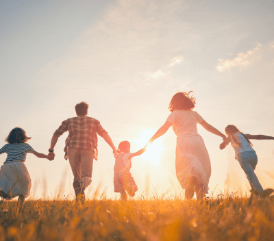 family running in a field 